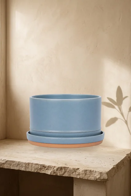 Source-preserved blue planter on a warm limestone 2:3 Pinterest scene